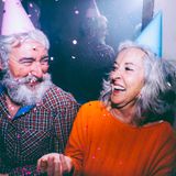 senior-couple-wearing-party-hat-head-enjoying-birthday-party_23-214809