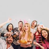 young-friends-with-birthday-cake_23-2147720226